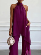 Conjunto de top morado sin mangas y pantalón