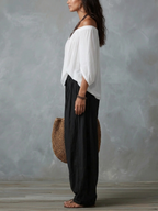 Conjunto de top blanco de hombros descubiertos y pantalón ancho