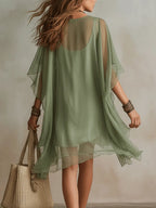 Vestido mini vaporoso verde de gasa con escote en V
