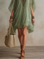 Vestido mini vaporoso verde de gasa con escote en V